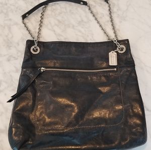 Coach tore or crossbody leather bag.